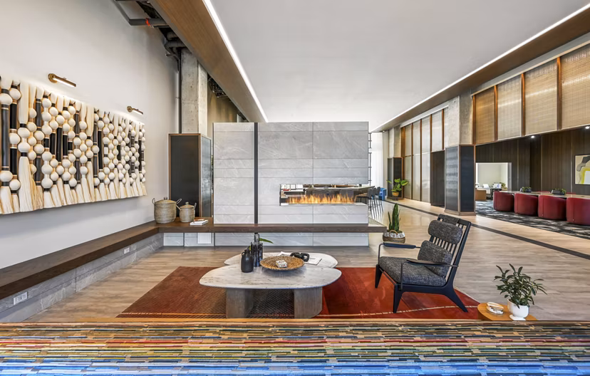 Stylish clubhouse with modern decor and seating at Anthem Everett Apartments, offering luxury living spaces and community areas