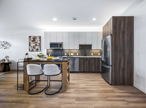 Modern kitchen with stainless steel appliances at Anthem Everett Apartments