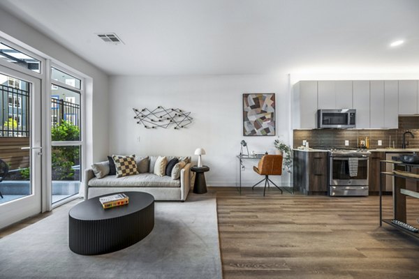 Cozy living room with modern decor and ample natural light at Anthem Everett Apartments