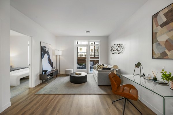 Modern living room with stylish furnishings and natural light at Anthem Everett Apartments