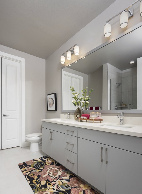 Broadstone North Lamar: Modern bathroom with sleek fixtures and granite countertops in luxury apartments near central Austin