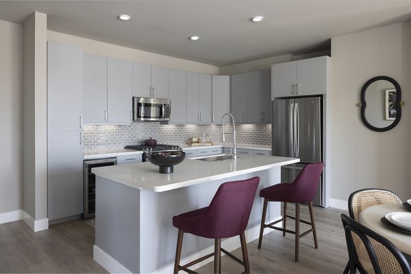 Contemporary kitchen with stainless steel appliances at Broadstone North Lamar luxury apartments