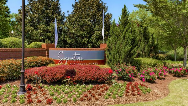 Signage at Signature at Sugarloaf Apartments showcasing modern design in vibrant Duluth community