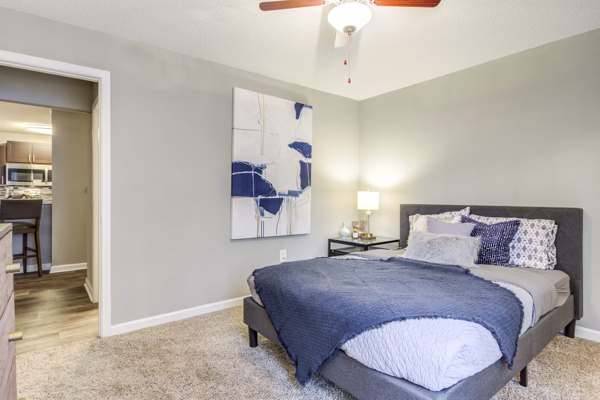 Bedroom featuring elegant decor and modern furnishings at Signature at Sugarloaf Apartments