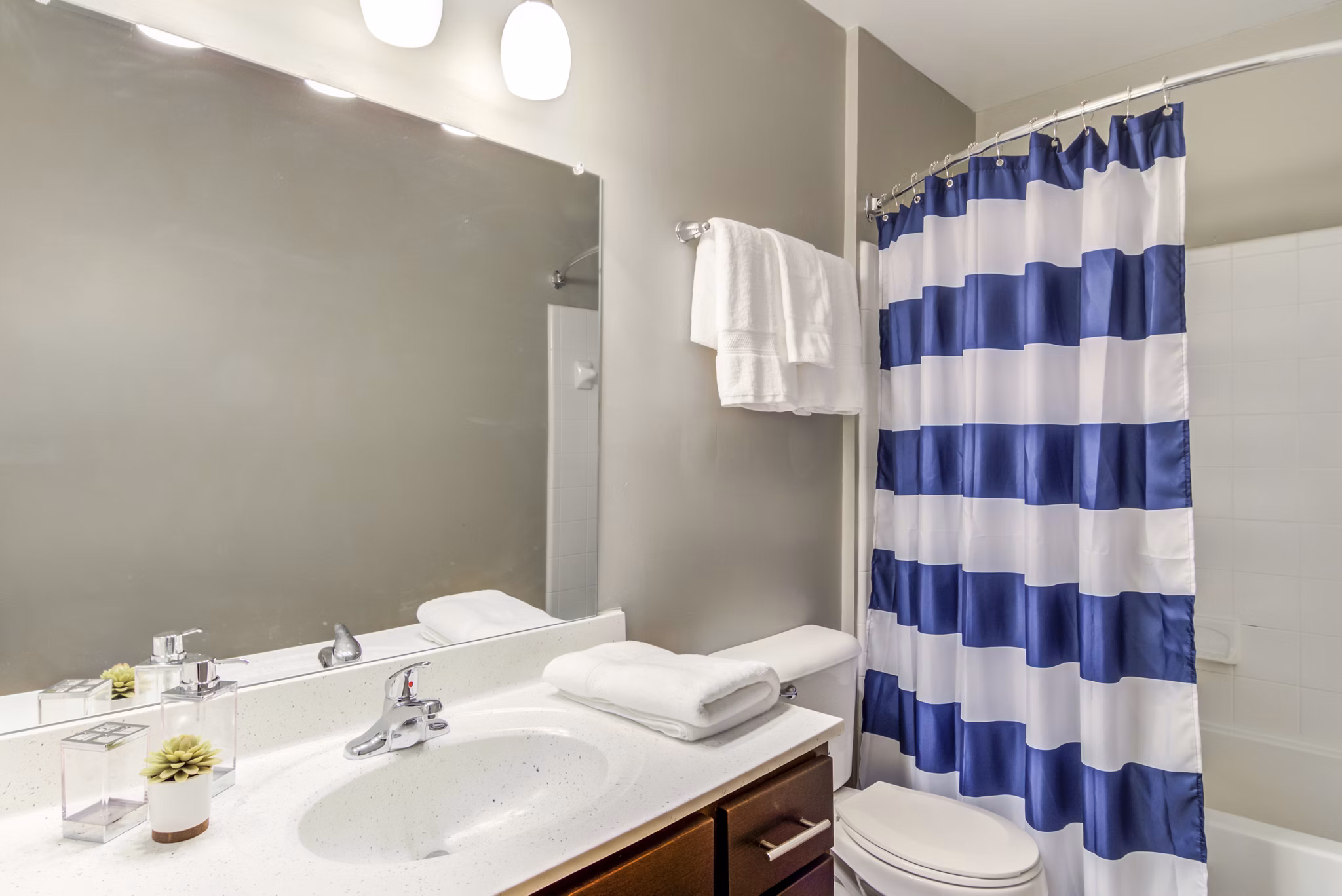 Modern bathroom with sleek fixtures at Signature at Sugarloaf Apartments