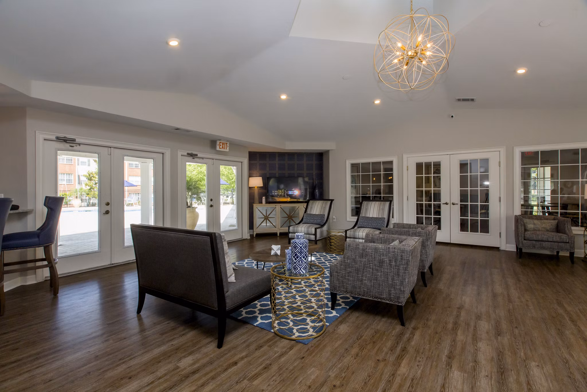 Clubhouse featuring modern lounge and entertainment areas at Signature at Sugarloaf Apartments