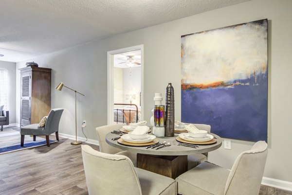 Dining area featuring modern furnishings and elegant lighting at Signature at Sugarloaf Apartments