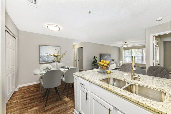 Modern kitchen featuring stainless steel appliances in Signature at Sugarloaf Apartments