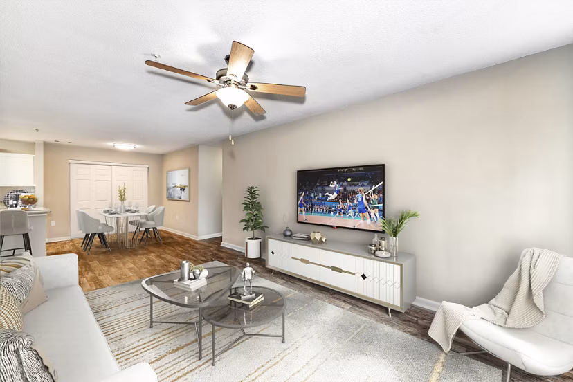 Spacious living room with modern decor in Signature at Sugarloaf Apartments, featuring luxury living spaces