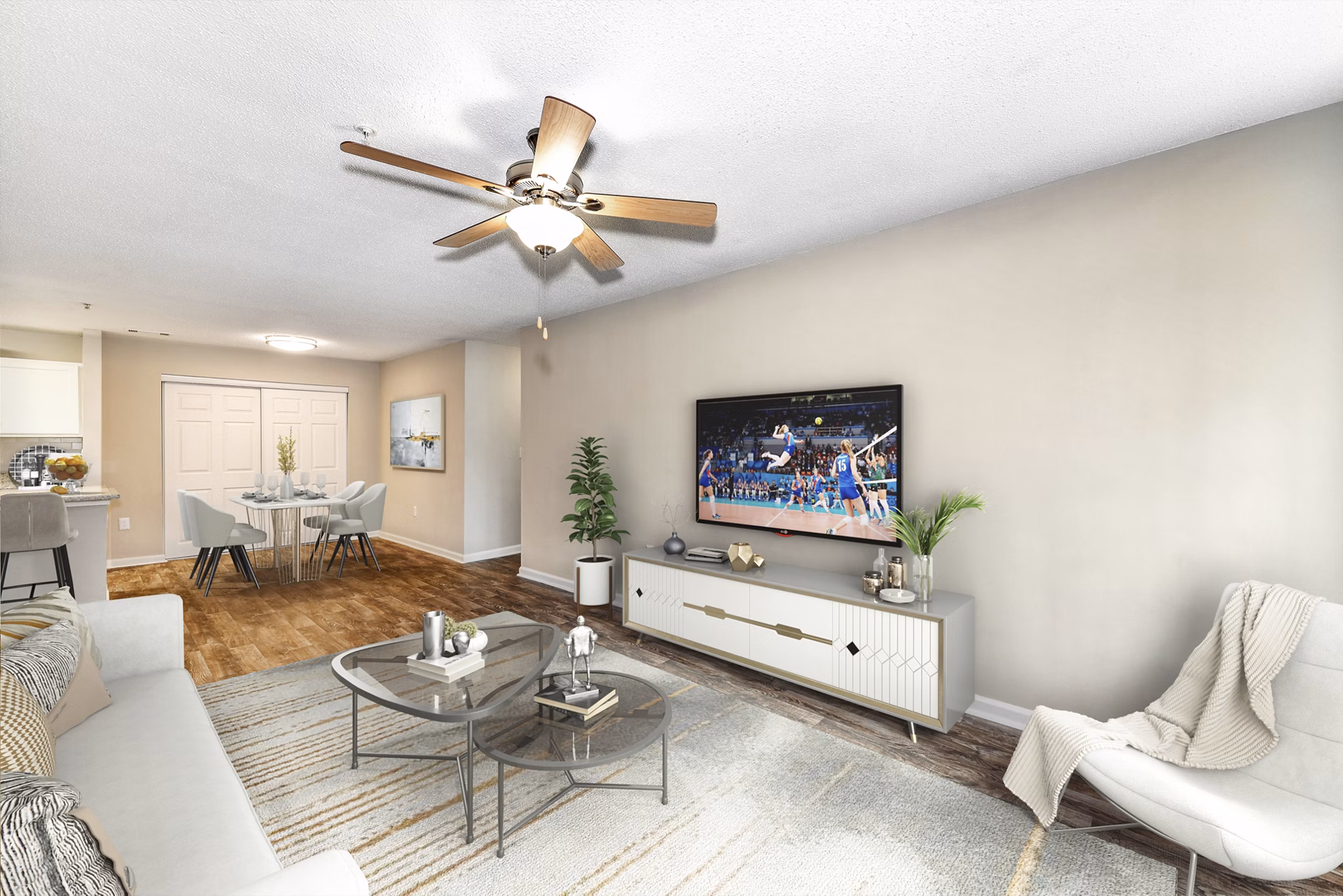 Spacious living room with modern decor in Signature at Sugarloaf Apartments, featuring luxury living spaces