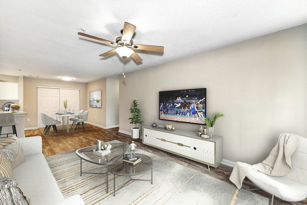 Spacious living room with modern decor in Signature at Sugarloaf Apartments, featuring luxury living spaces