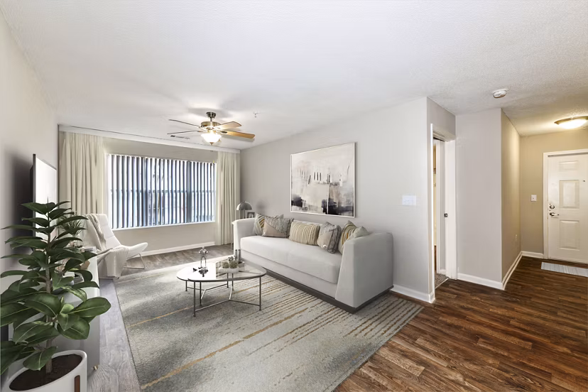 Living room with contemporary design and sleek furniture at Signature at Sugarloaf Apartments