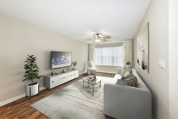 Open-concept living room with modern decor at Signature at Sugarloaf Apartments