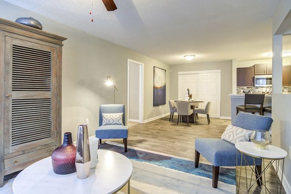 Spacious living room with modern decor at Signature at Sugarloaf Apartments