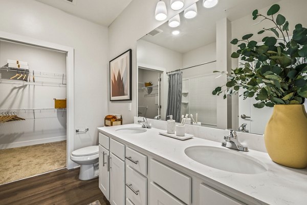 Luxurious bathroom featuring elegant fixtures at Attain at Bradford Creek Apartments, a Greystar community