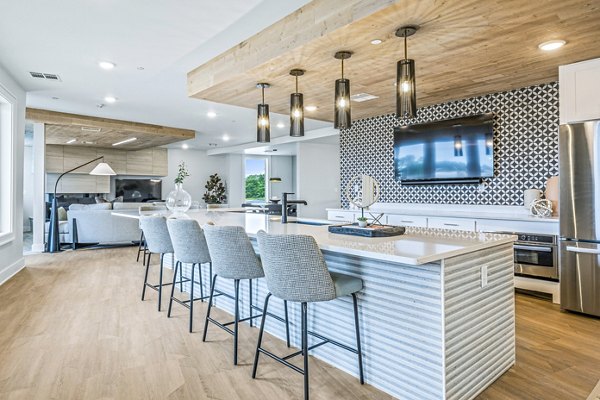 Clubhouse featuring modern design elements at Attain at Bradford Creek Apartments, a luxury Greystar community