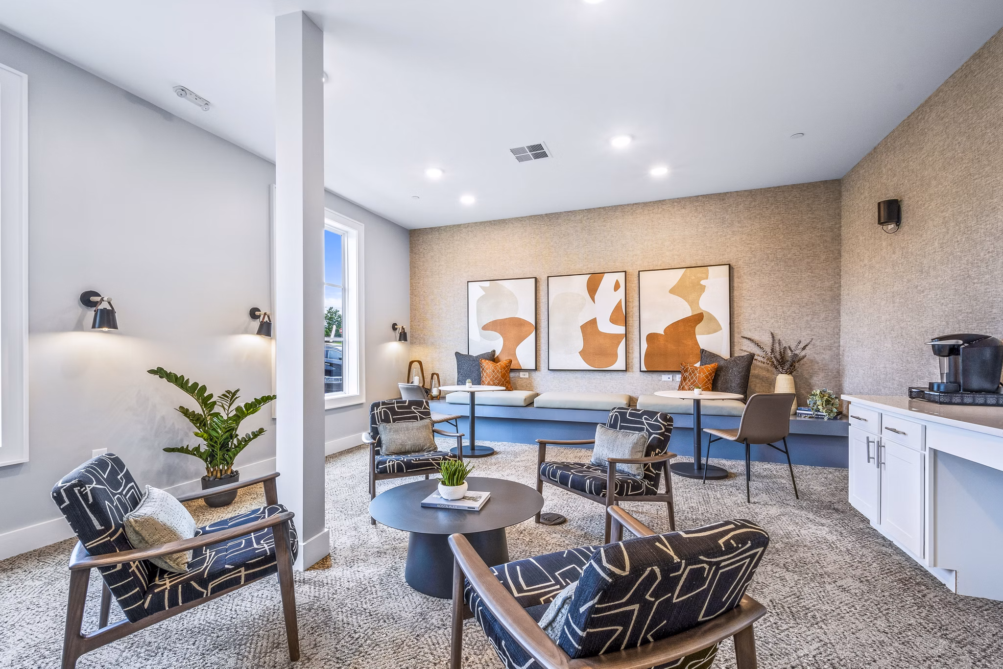 Elegant clubhouse with lounge seating at Attain at Bradford Creek Apartments, offering luxury community living experiences