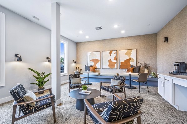 Elegant clubhouse with lounge seating at Attain at Bradford Creek Apartments, offering luxury community living experiences