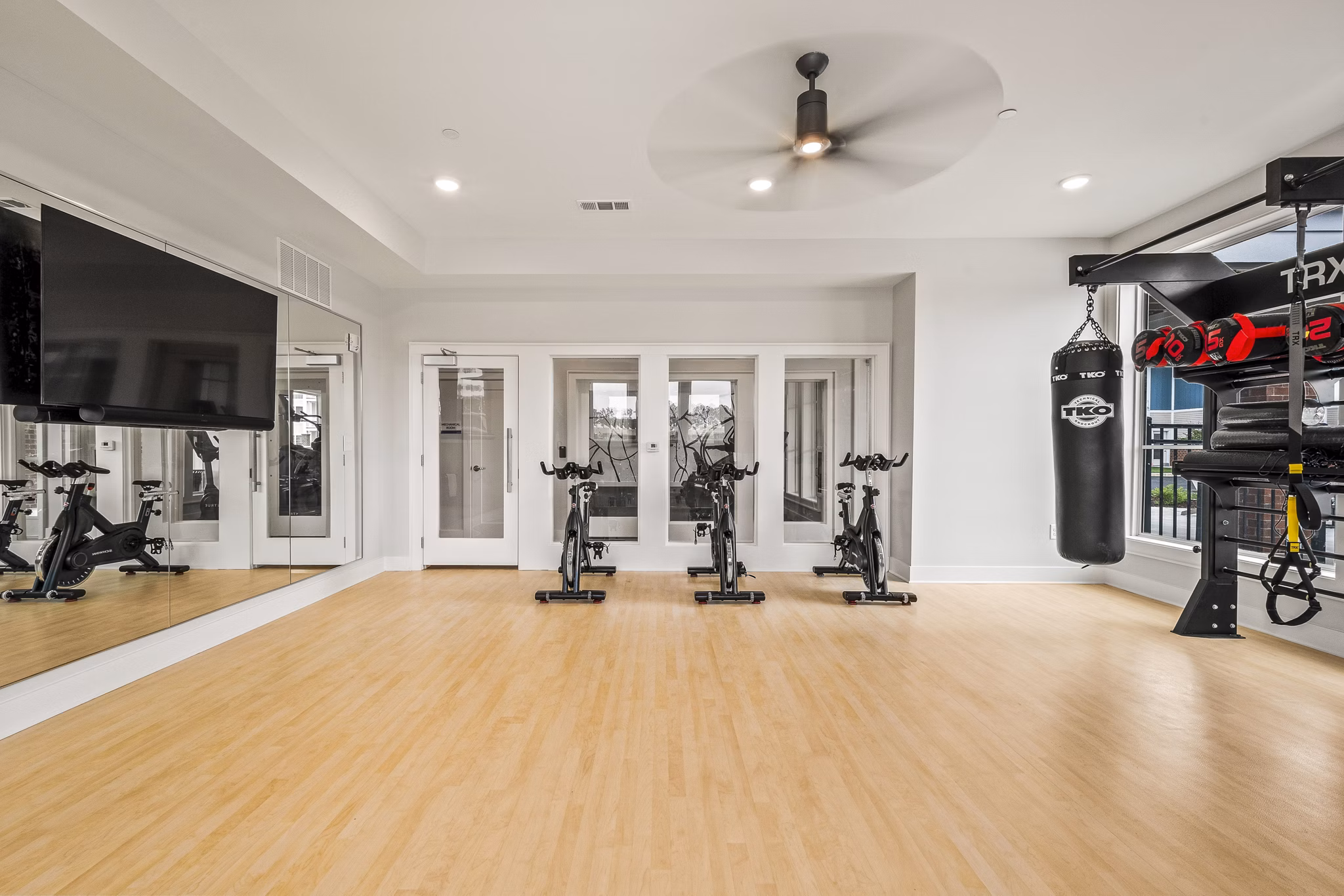 Modern yoga/spin studio with sleek equipment at Attain at Bradford Creek Apartments