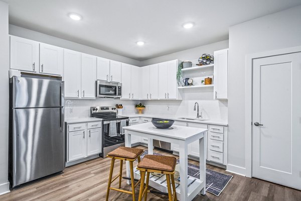Modern kitchen with stainless appliances at Attain at Bradford Creek Apartments