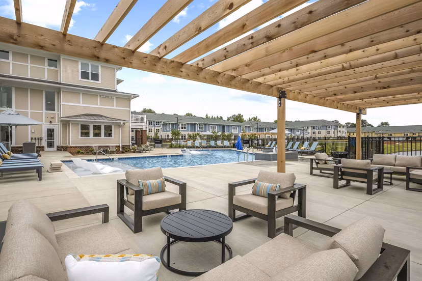 Modern pool patio at Attain at Bradford Creek Apartments offering relaxation and recreation
