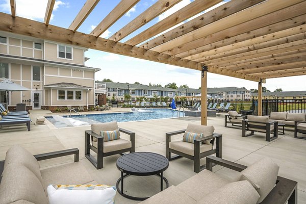 Modern pool patio at Attain at Bradford Creek Apartments offering relaxation and recreation