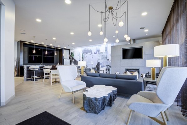 Modern clubhouse with stylish seating and entertainment options at Parq 170 Apartments