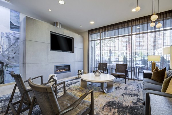 Clubhouse featuring modern lounge seating and entertainment area at Parq 170 Apartments in luxury apartment community