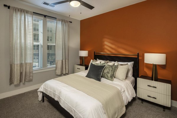Spacious bedroom with large windows at The Boulevard, a luxury Broadstone Community apartment