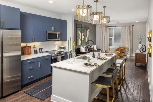 Modern kitchen with stainless steel appliances and quartz countertops at The Boulevard, a Broadstone Community Apartments