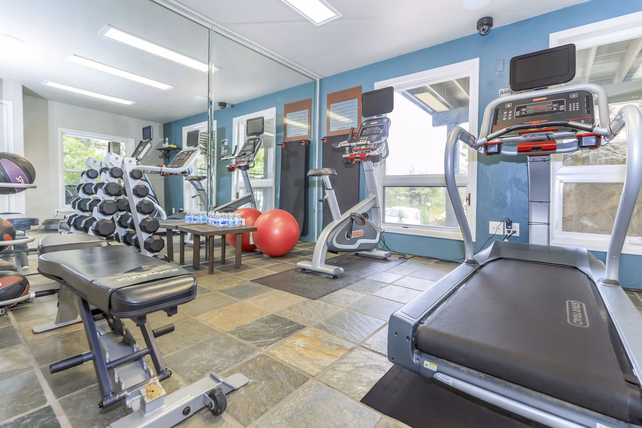 fitness center at Pines at Broadmoor Bluffs Apartments