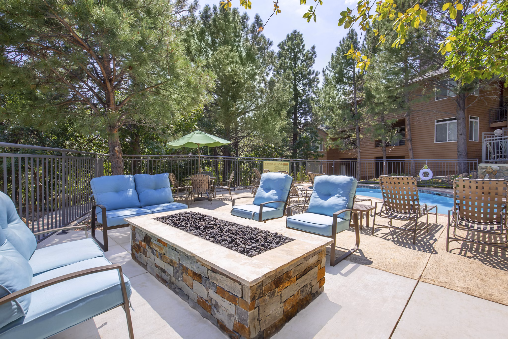 fire pit at Pines at Broadmoor Bluffs Apartments