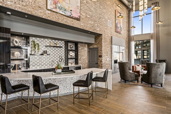 Clubhouse featuring modern design and ample seating at The Terra Apartment Homes