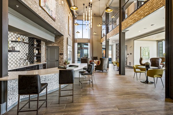 Clubhouse featuring modern decor and spacious seating at The Terra Apartment Homes