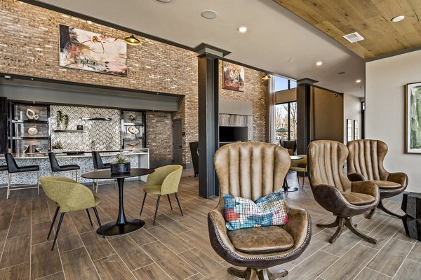Clubhouse featuring stylish lounge seating and modern decor at The Terra Apartment Homes