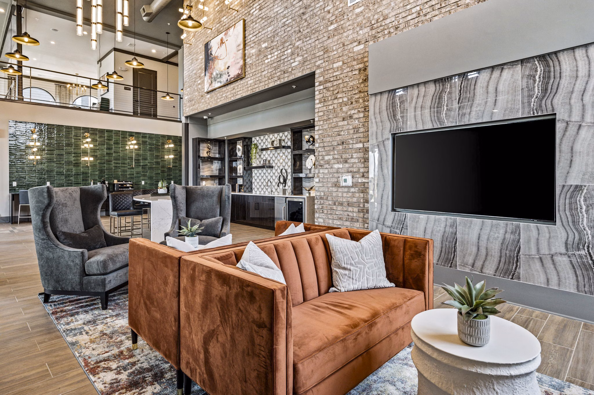 Clubhouse featuring modern design and cozy seating at The Terra Apartment Homes in Greystar community