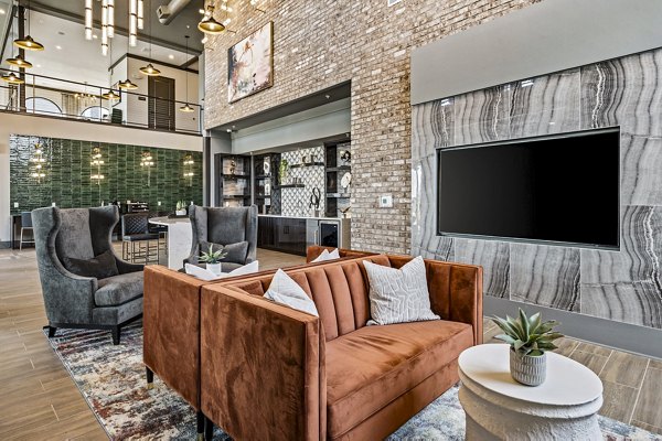 Clubhouse featuring modern design and cozy seating at The Terra Apartment Homes in Greystar community