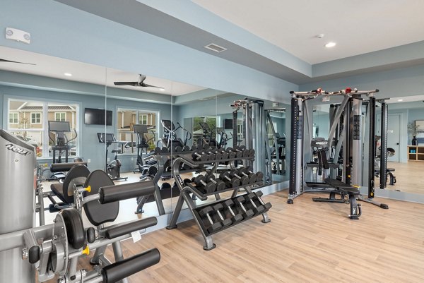 fitness center at The Village at Compass Pointe Apartments