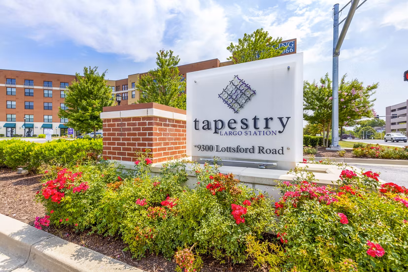 Illuminated signage at Tapestry Largo Station Apartments