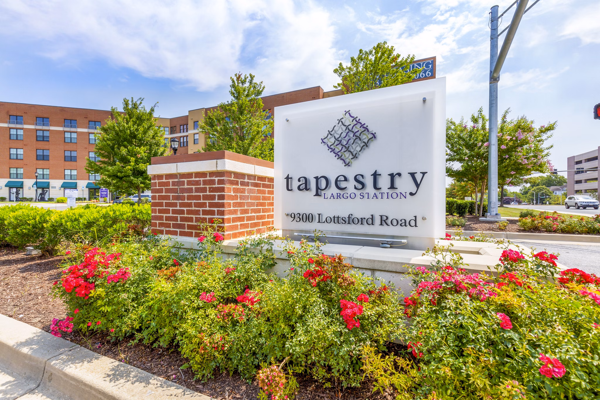 Illuminated signage at Tapestry Largo Station Apartments