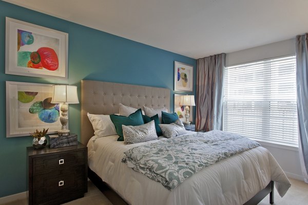 Cozy bedroom with elegant decor at Tapestry Largo Station Apartments