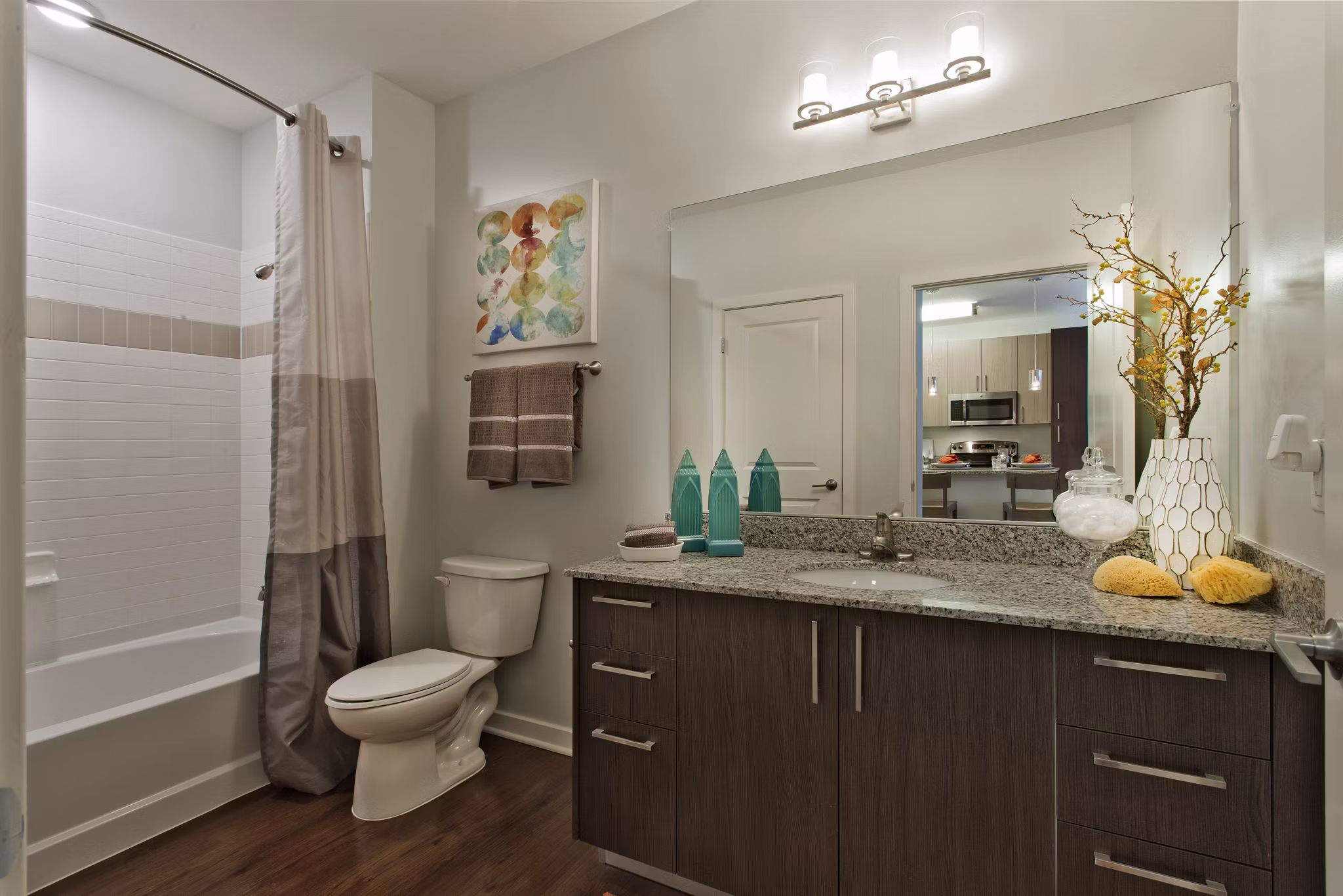 Bathroom featuring modern fixtures and spacious shower at Tapestry Largo Station Apartments