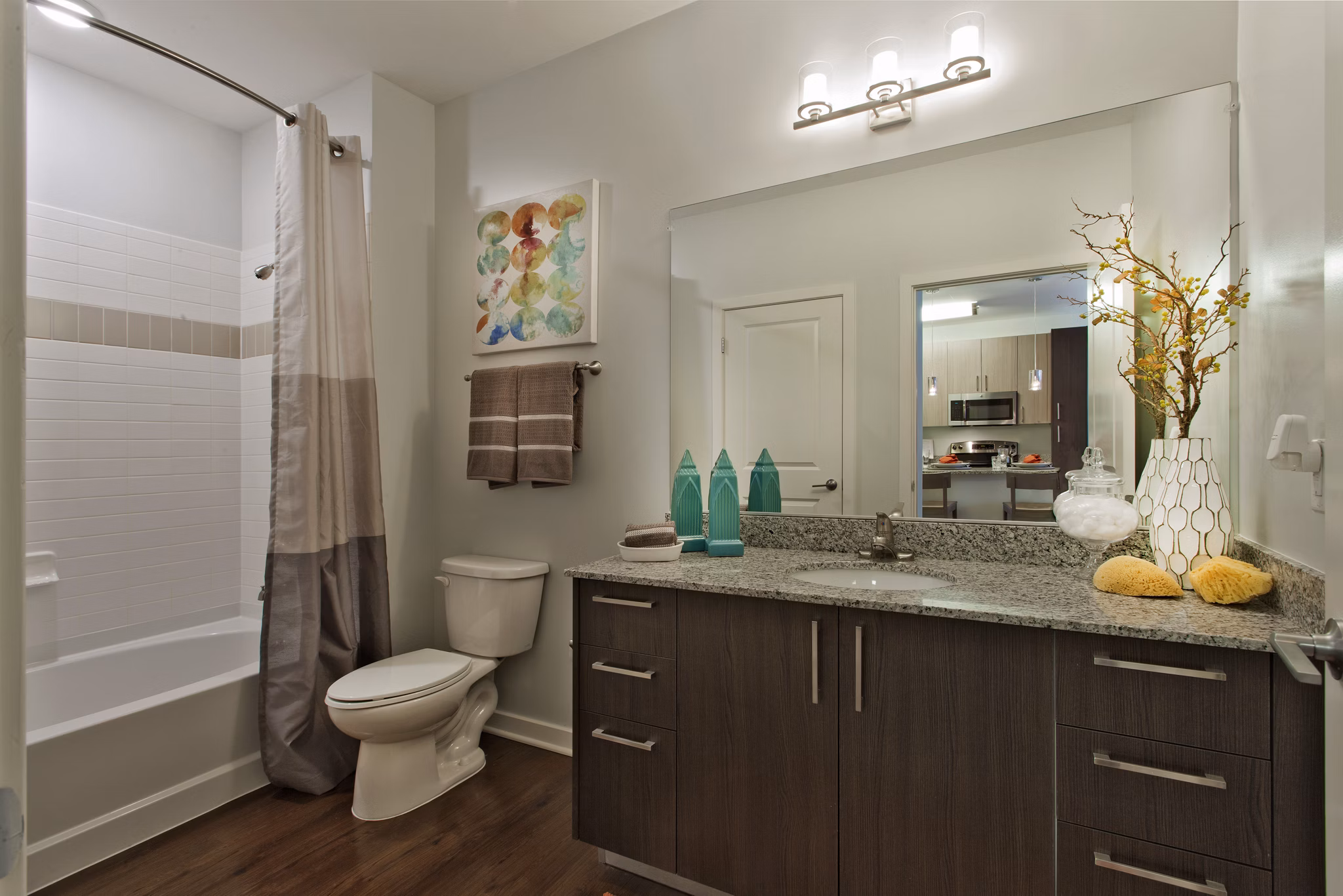 Bathroom featuring modern fixtures and spacious shower at Tapestry Largo Station Apartments