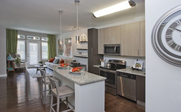 Tapestry Largo Station Apartments: Kitchen with sleek countertops and modern appliances