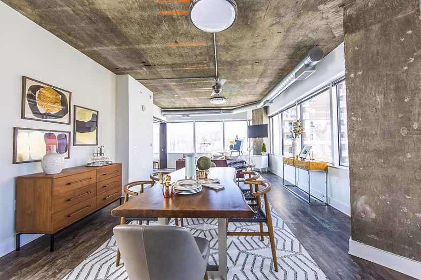 Dining room featuring modern dÃ©cor and ample seating at Elofts Apartments, ideal for luxury living in a vibrant community setting