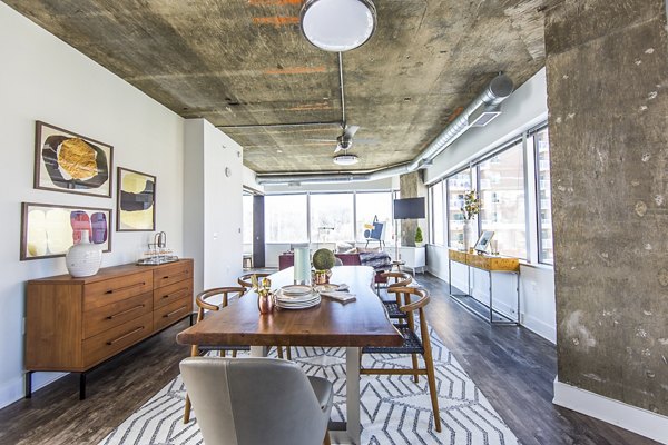 Dining room featuring modern dÃ©cor and ample seating at Elofts Apartments, ideal for luxury living in a vibrant community setting