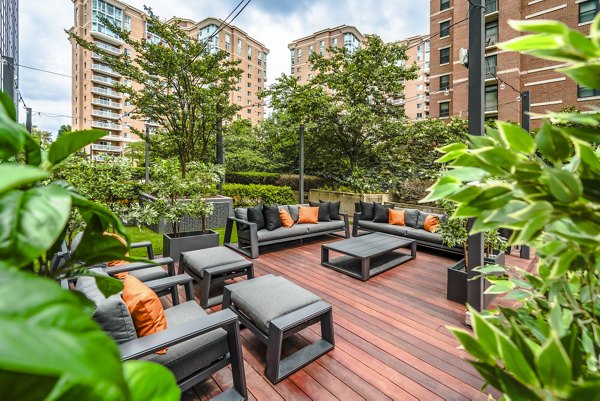 Inviting patio space with modern seating at Elofts Apartments, perfect for socializing in an upscale community setting