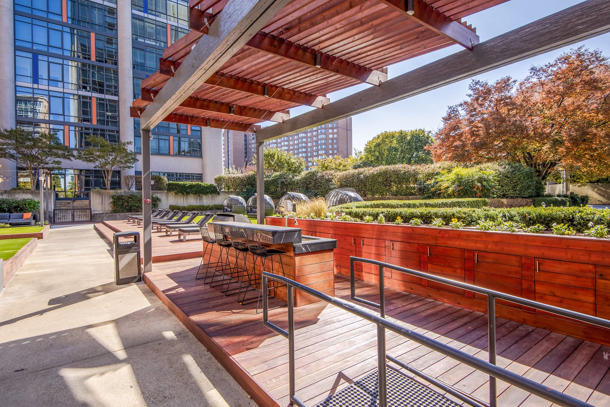 Grill and lounge area on the patio at Elofts Apartments, perfect for outdoor dining and relaxation