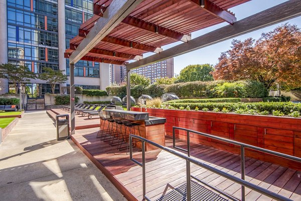 Grill and lounge area on the patio at Elofts Apartments, perfect for outdoor dining and relaxation
