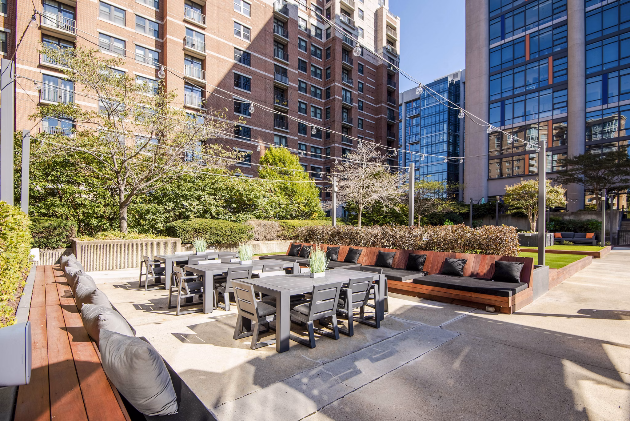 Chic outdoor patio space with modern seating at Elofts Apartments, perfect for relaxation and social gatherings